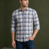 Man wearing a casual blue checks shirt by BSG Garments